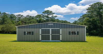 Spacious metal portable shed in a backyard, used for extra storage and outdoor equipment organization