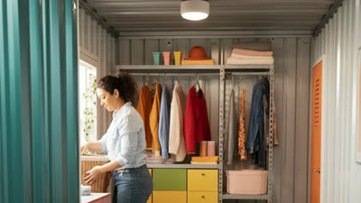 Organized craft station inside a she shed with bright decor and shelving