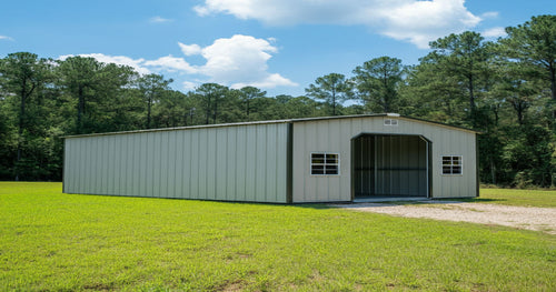 Neatly arranged portable garage interior with shelves, hooks, and lawn equipment storage