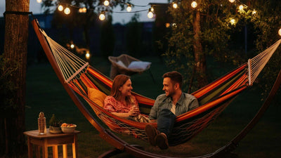 Portable metal shed with gardening tools, lawn equipment, and organized shelving inside.