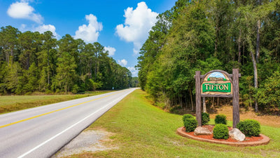 Tifton homeowner organizing tools inside a climate-resistant metal shed