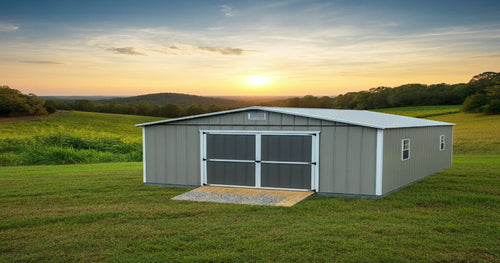 A durable metal storage building set against a rural Alabama landscape, designed for extreme weather conditions