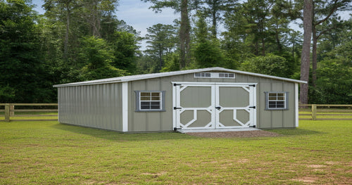 Large portable storage building in a backyard, providing extra storage space