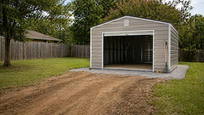  Metal storage shed with roll-up door installed on a level gravel pad in a backyard