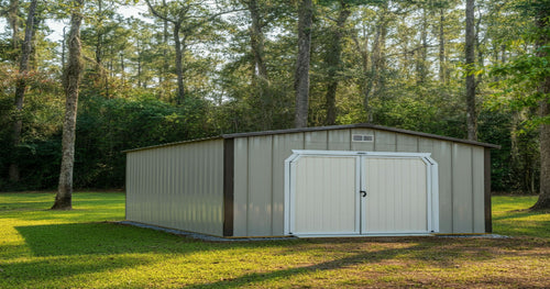 Prefab portable storage shed being delivered and installed on a residential property