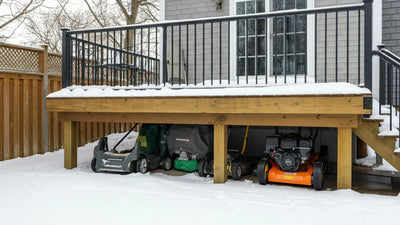 Sleek gray metal shed with large windows and a modern home office setup.